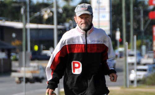 Carl Hebel and his canine running companion, Dina, train along the Bruce Highway. Carl Hebel and his canine running companion, Dina, train along the Bruce Highway.
